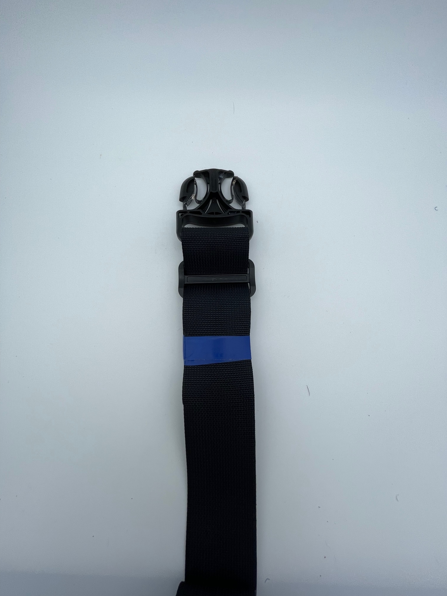 Excess strap secured with tape
